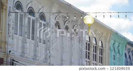 Detailed view of windows, doors and balconies of city buildings  121809039