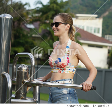 A young woman enjoying an workout outdoors  121809123