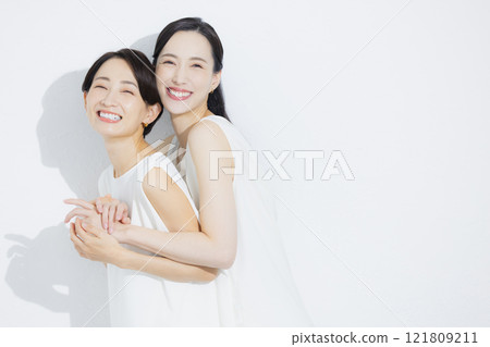 Two cuddling women Two cuddling women 121809211