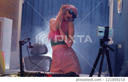 Beautiful young singer and musician broadcast from her home studio 121809218