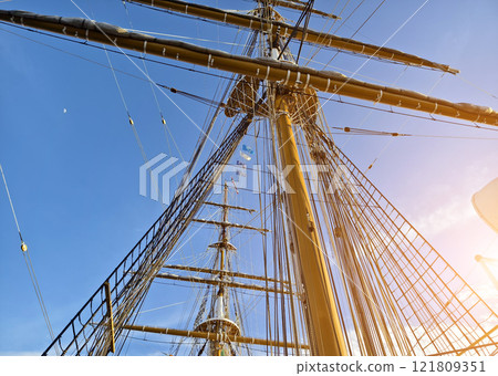 Ropes stretched across the masts of an old ship Ropes stretched across the masts of an old ship 121809351