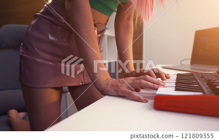 Beautiful young singer and musician broadcast from her home studio 121809355