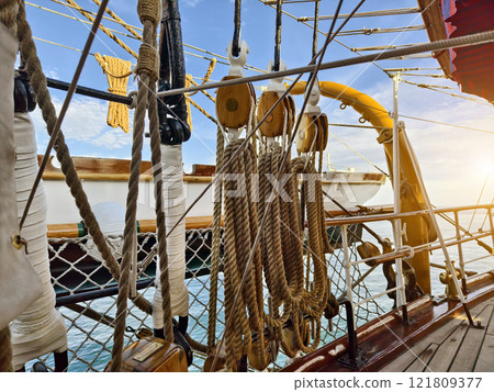 Ropes stretched across the masts of an old ship Ropes stretched across the masts of an old ship 121809377