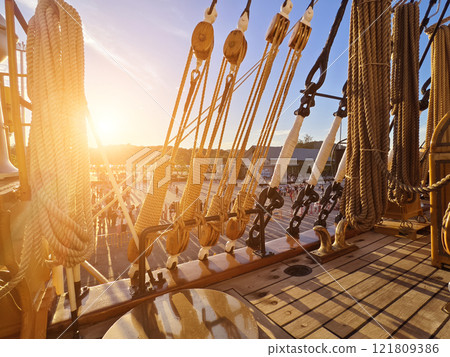 Ropes stretched across the masts of an old ship Ropes stretched across the masts of an old ship 121809386