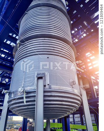 Steel structure is under construction on the construction site against a blue sky backdrop 121809464