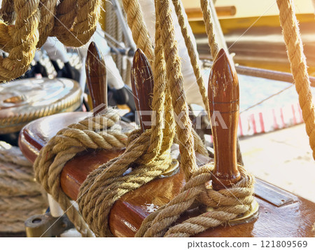 Ropes stretched across the masts of an old ship 121809569