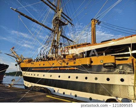 A large old ship at pier under a beautiful blue sky 121809585