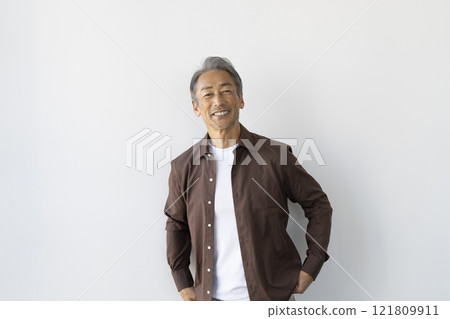 A man in his 60s smiling at the camera 121809911