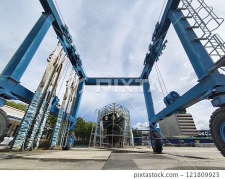 A large blue gantry crane for boats A large blue gantry crane for boats 121809925