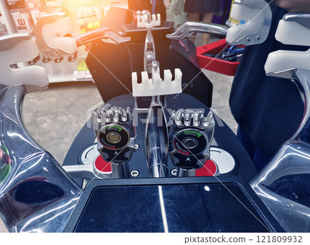 Strings a badminton racket on a racket stringing machine. 121809932