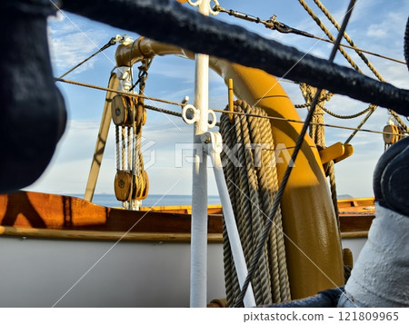 Ropes stretched across the masts of an old ship 121809965