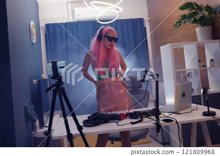 Beautiful young singer and musician broadcast from her home studio Beautiful young singer and musician broadcast from her home studio 121809968