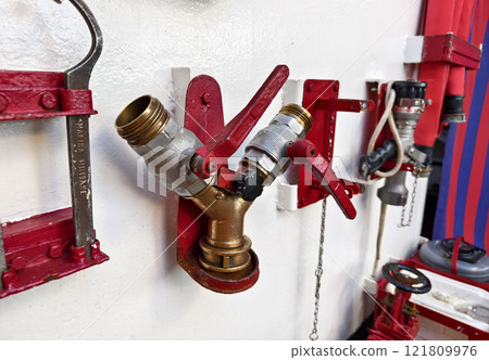 A fire hydrant with two separate valves on an vessel 121809976