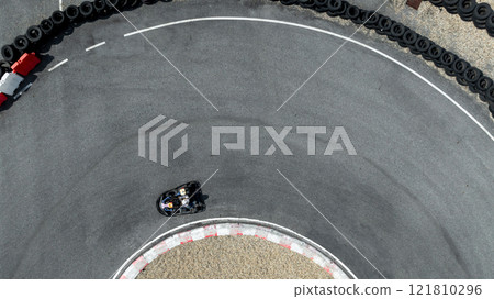 Aerial view go kart racer race curve circuit, Go kart at circuit curve, Top view race go kart track curve. Aerial view go kart racer race curve circuit, Go kart at circuit curve, Top view race go kart track curve. 121810296
