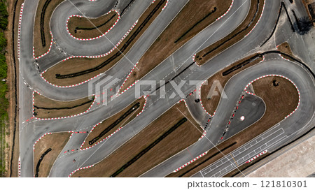 Aerial view race go-kart track, Track for auto racing top view, Car race asphalt and curve street circuit, Go-kart winding race track. Aerial view race go-kart track, Track for auto racing top view, Car race asphalt and curve street circuit, Go-kart winding race track. 121810301