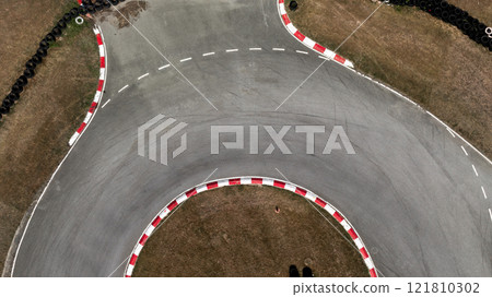 Aerial view race go-kart track, Track for auto racing top view, Car race asphalt and curve street circuit, Go-kart winding race track. Aerial view race go-kart track, Track for auto racing top view, Car race asphalt and curve street circuit, Go-kart winding race track. 121810302