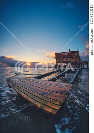 Wodden stilt house in st. peter-ording at sunset 121811015