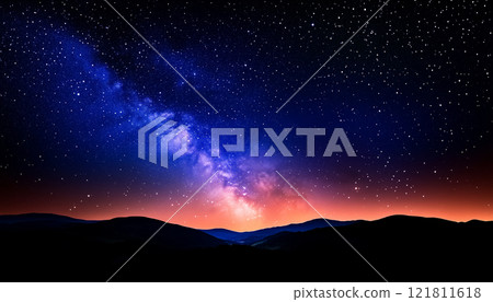 Starry Night Sky with Milky Way and Distant Mountains Under Vivid Blue and Purple Tones 121811618