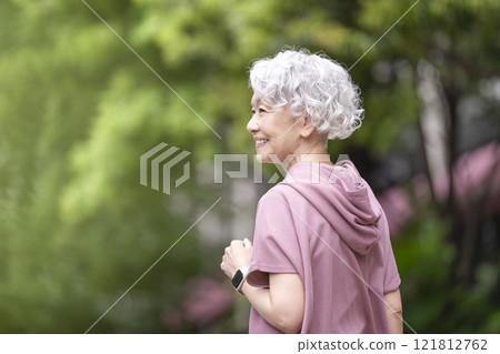 Senior woman walking Senior woman walking 121812762
