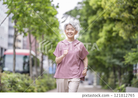 Senior woman running Senior woman running 121812765