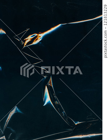 Distressed foil overlay. Creased film. Scratched glass texture. Blue orange color glitch light flares dust particles wrinkled rough filter dark black illustration art abstract background. Distressed foil overlay. Creased film. Scratched glass texture. Blue orange color glitch light flares dust particles wrinkled rough filter dark black illustration art abstract background. 121813229
