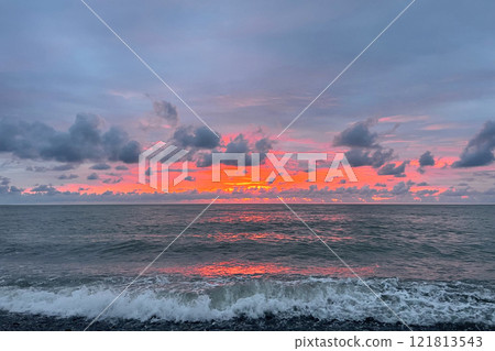 Weather background. Blue sea wave under sunrise sky cloud 121813543