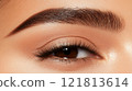 A close-up of perfectly shaped eyebrows 121813614