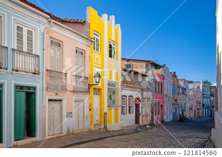 Vibrant colonial street in Salvador de Bahia with colorful houses under a blue sky 121814560