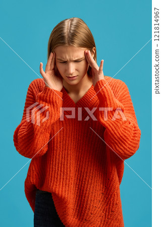 on blue studio background 121814967