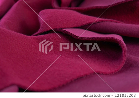 layers of French terry pink amaranth textile. A piece of fabric lies in waves 121815208