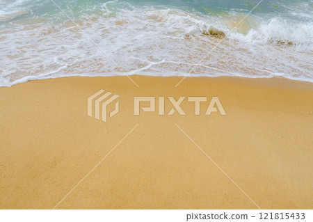Serene Morning Sunrise Over Golden Sandy Beach with Gentle Waves and Tranquil Atmosphere Serene Morning Sunrise Over Golden Sandy Beach with Gentle Waves and Tranquil Atmosphere 121815433