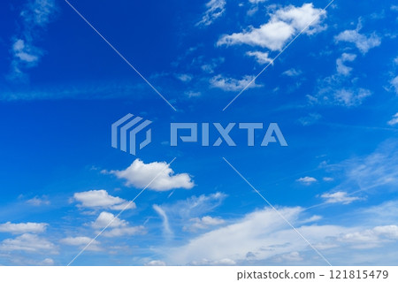 Breathtaking Scenic View of a Clear Blue Sky Filled with Fluffy White Clouds for Creative Projects Breathtaking Scenic View of a Clear Blue Sky Filled with Fluffy White Clouds for Creative Projects 121815479