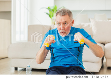 Fitness workout training. Senior man boxing punching picking up dumbbells. Old adult mature healthy man doing sports exercise at home. Grandfather have workout rehabilitation. Health care healthy 121817313