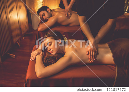 Caucasian couple customer enjoying relaxing anti-stress massage. Quiescent 121817372