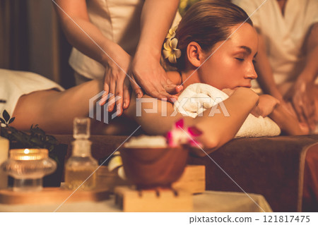 Caucasian couple customer enjoying relaxing anti-stress massage. Quiescent Caucasian couple customer enjoying relaxing anti-stress massage. Quiescent 121817475