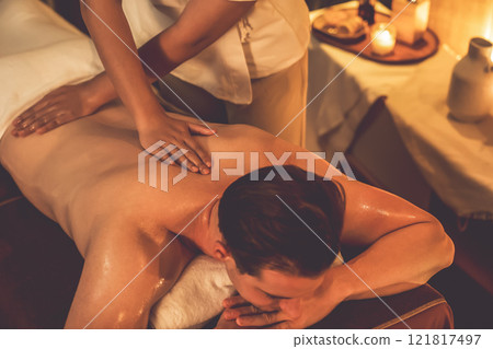 Caucasian man customer enjoying relaxing anti-stress massage. Quiescent 121817497