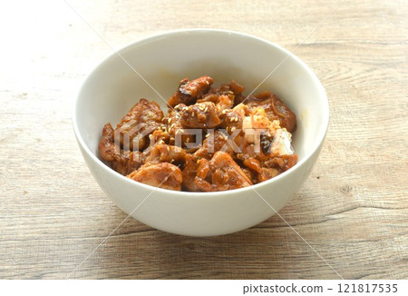 fried slice fermenting pork meat and mala sichuan sauce topping white sesame on plain rice in bowl fried slice fermenting pork meat and mala sichuan sauce topping white sesame on plain rice in bowl 121817535