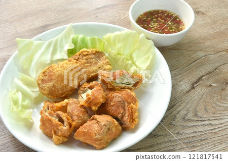 fried slice Vietnamese chicken sausage recipe with cabbage on plate dipping spicy sauce 121817541