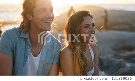 happy couple smiling on beach at sunset enjoying summer happy couple smiling on beach at sunset enjoying summer 121819026