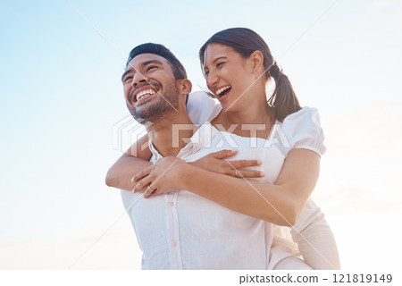 Outdoor, couple and carrying with smile on vacation, travel holiday and connection on valentines day. Laughing, man and woman with piggyback for relationship, bonding or anniversary romance with love Outdoor, couple and carrying with smile on vacation, travel holiday and connection on valentines day. Laughing, man and woman with piggyback for relationship, bonding or anniversary romance with love 121819149