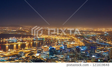 Landscape of night city lights in Cape Town, South Africa with copy space. Night cityscape of a modern vacation or holiday destination. A bright and vibrant urban skyline at sunset 121819648