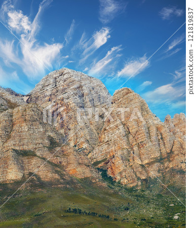 Landscape of beautiful twelve apostles mountain range. A scenic outdoor travel destination, landmark and hiking trail. A popular Cape Town, vacation travel location for explorers seeking adventure Landscape of beautiful twelve apostles mountain range. A scenic outdoor travel destination, landmark and hiking trail. A popular Cape Town, vacation travel location for explorers seeking adventure 121819837