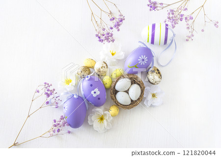 Happy Easter holiday greeting card template; Top view for easter eggs, flowers on white wooden background; copy space Happy Easter holiday greeting card template; Top view for easter eggs, flowers on white wooden background; copy space 121820044