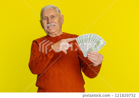 Rich happy senior man winner waving money dollar cash like a fan, big income wealth success business Rich happy senior man winner waving money dollar cash like a fan, big income wealth success business 121820732