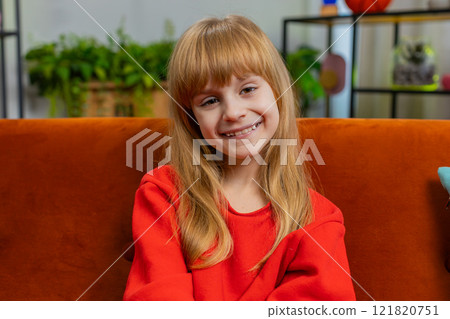 Portrait of happy smiling Caucasian preteen school girl child kid looking at camera, home play room Portrait of happy smiling Caucasian preteen school girl child kid looking at camera, home play room 121820751