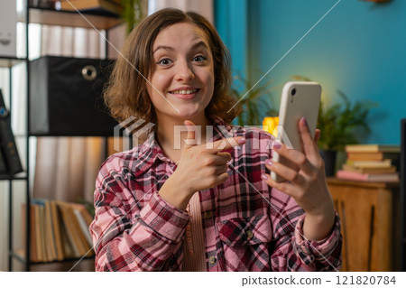 Business woman girl using smartphone social media app game online pointing showing like thumbs up Business woman girl using smartphone social media app game online pointing showing like thumbs up 121820784