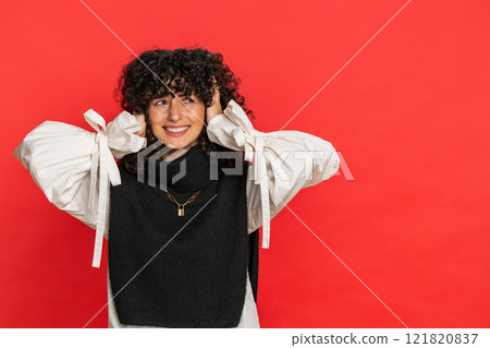 Annoyed irritated woman covering ears gesturing no avoiding advice ignoring noise loud voices 121820837