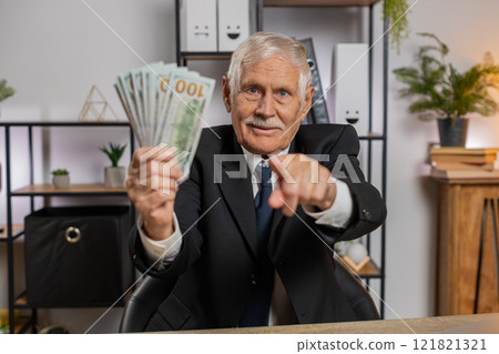 Rich grandfather businessman working on laptop counting money cash, calculate profit at home office Rich grandfather businessman working on laptop counting money cash, calculate profit at home office 121821321