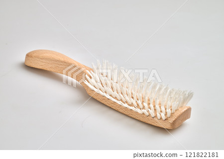 Wooden Hair brush with handle isolated on white bakground 121822181