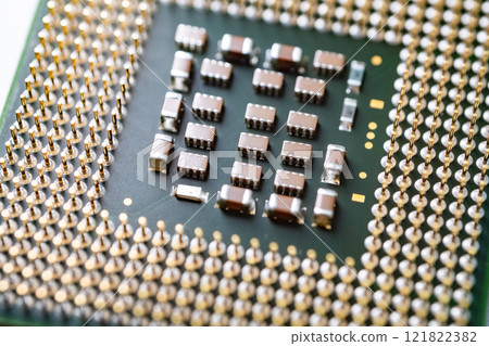 High definition macro shot of CPU processor, electronic components and gold pins High definition macro shot of CPU processor, electronic components and gold pins 121822382